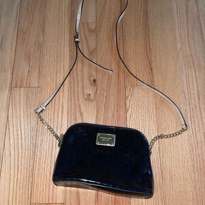 Michael Kors- Black patent leather crossbody purse with gold chain and accents